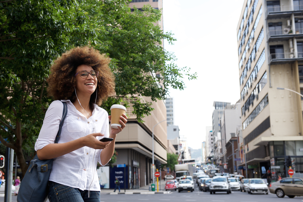 Cheerful African American woman with pre-lightened hair wearing light tips dyed with Ion Color Brilliance Brights.