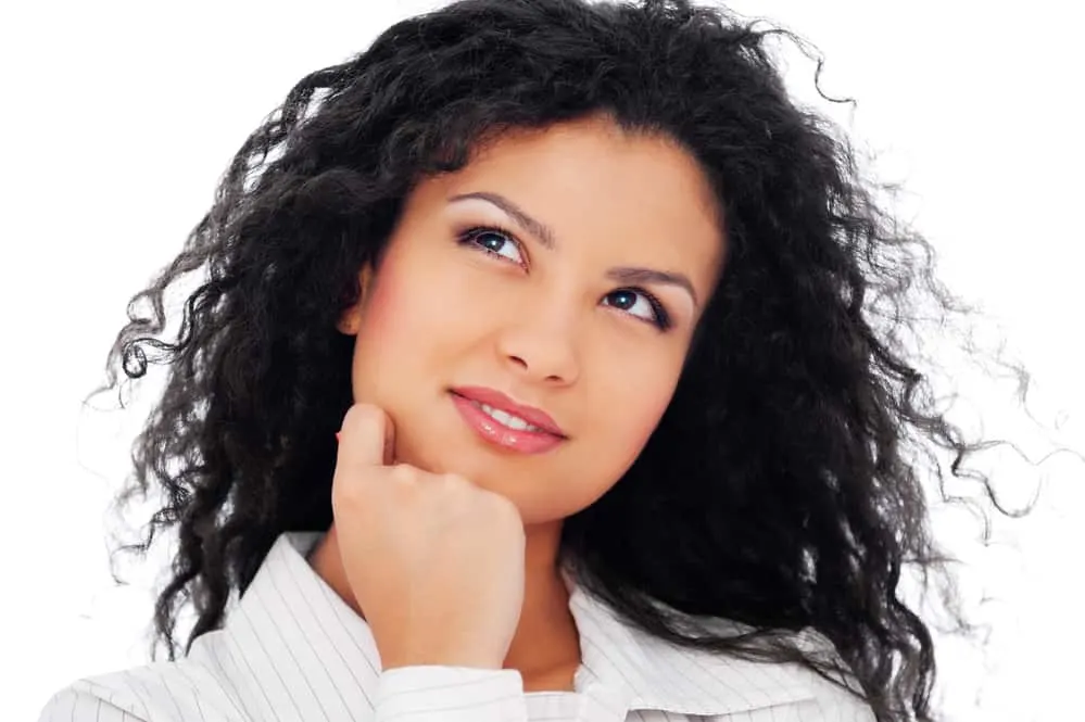 Why Does My Hair Smell Like Wet Dog? How To Get Rid of the Smell 4 White female with oily hair looking up towards the sky