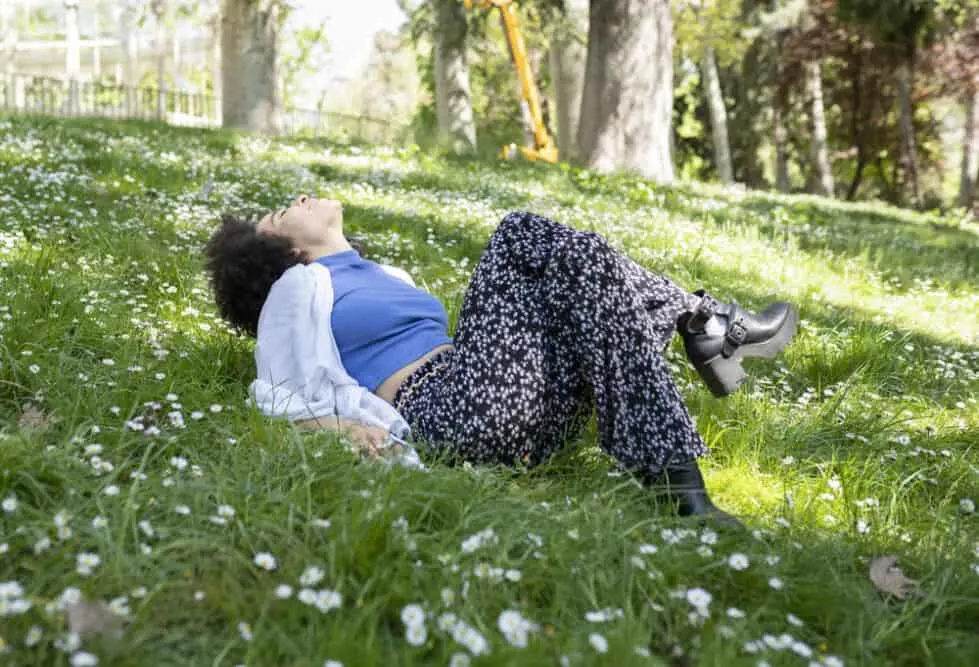 Woman relaxing outside after a waxing treatment to prevent ingrown hairs