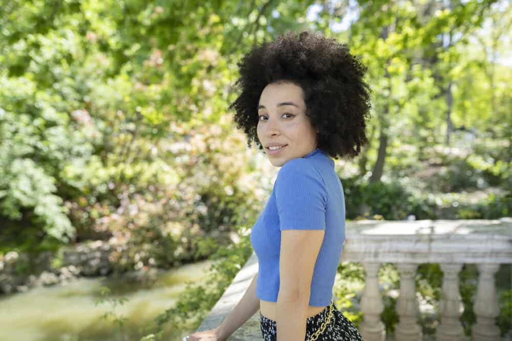 Pretty African American woman soaking up the vitamin D by getting direct sun exposure