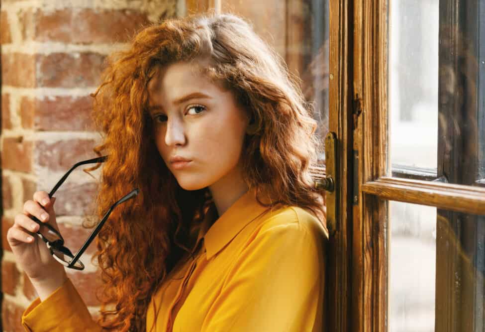 Do Perms Damage Your Hair? Permanently? Are They Good or Bad? 2 Serious young lady with virgin hair that been styled with a perm solution.