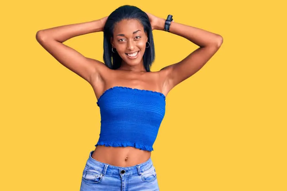 What Does Damaged Hair Look Like? Wet? Curly? DIY Remedies 6 Lady with a Dominican Blowout hairdo styled with natural oils and essential vitamins after a conditioning treatment.