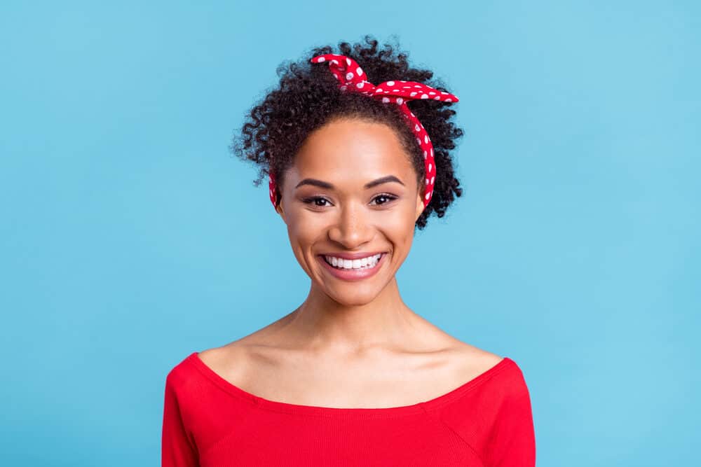 Adorable sweet black girl with 3B natural hair using the Curly Girl Method to support her hair health.