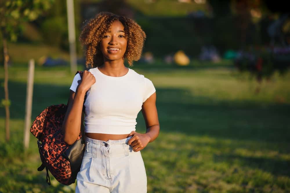 Young black female in casual clothes with a dark brown natural hair color on 4A fine hair strands.