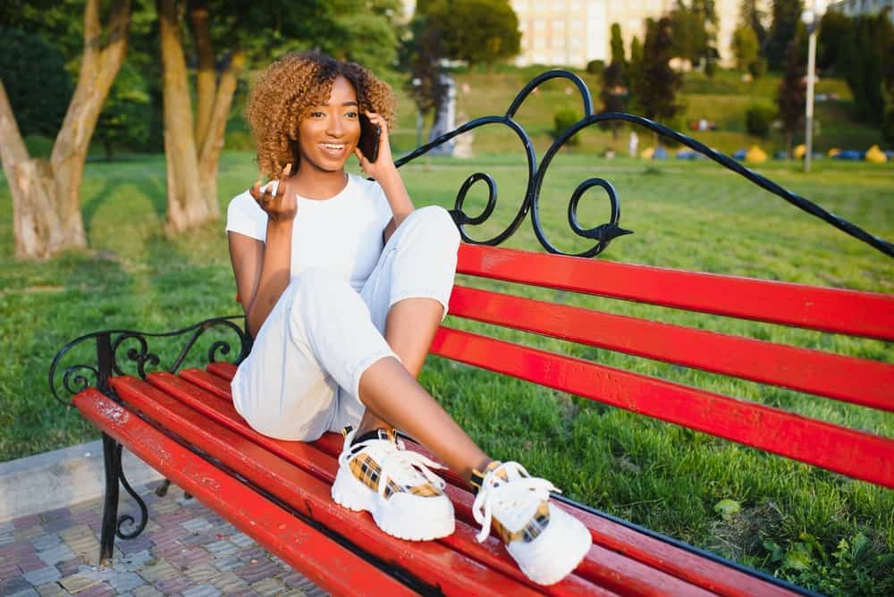 Beautiful African American woman 4A hair thickness and darker hair wearing color-treated hair.