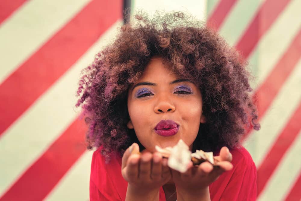 Cute black girl with bleached hair that has been dyed with brown and purple demi-permanent hair dyes.