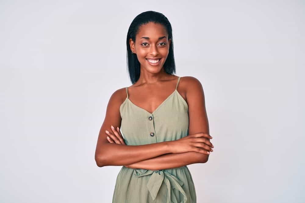 Cute African American with straight hair prior to using a Brazilian Blowout Treatment.