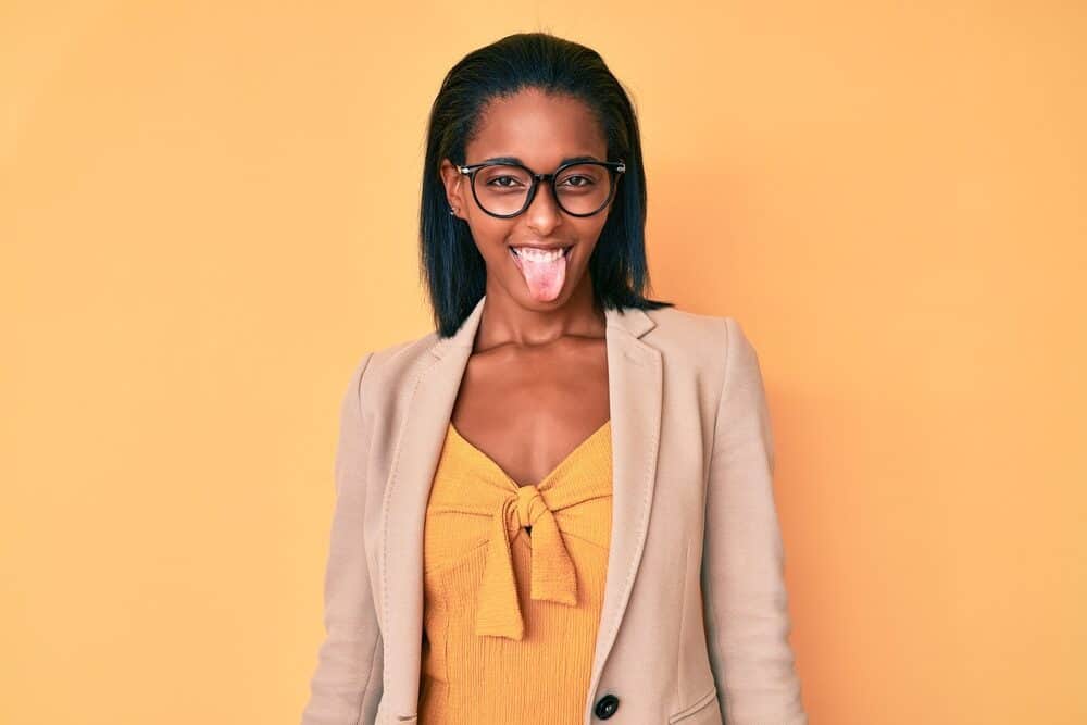 Young woman making a funny facial expression with relaxed hair from a Dominican Blowout.