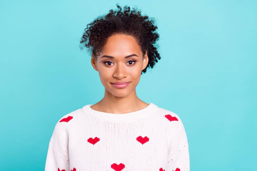 African American female with 3B curls dyed with mixed blue-black permanent color box dyes.