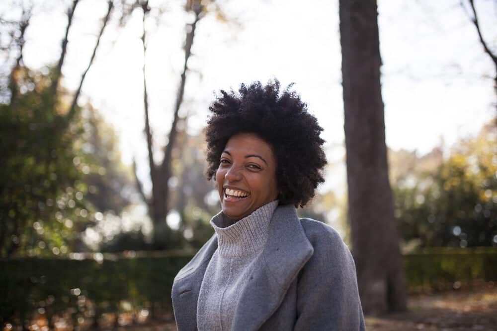 African American lady with fine hair wearing a kinky wash and go after a deep conditioning hair mask.