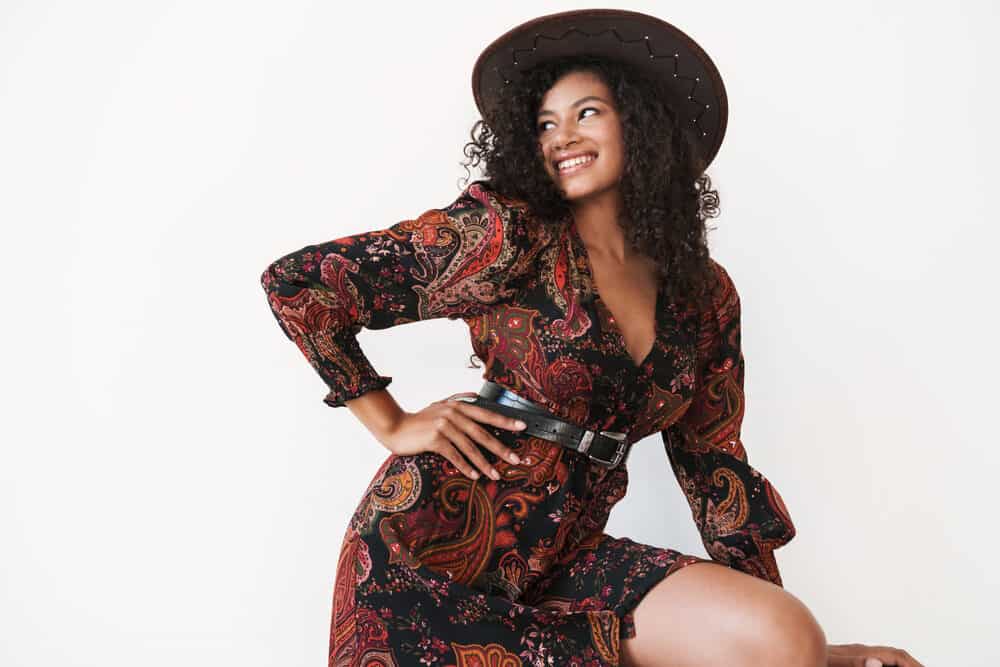 African American female with cowgirl hair with a wash and go hairstyle created with tea tree oil.