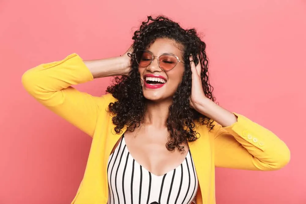 Is Curly Hair Attractive? Why? What Do Guys Think? 7 A cute woman with fine hair wearing loose curls that require little effort with her 3B hair type.