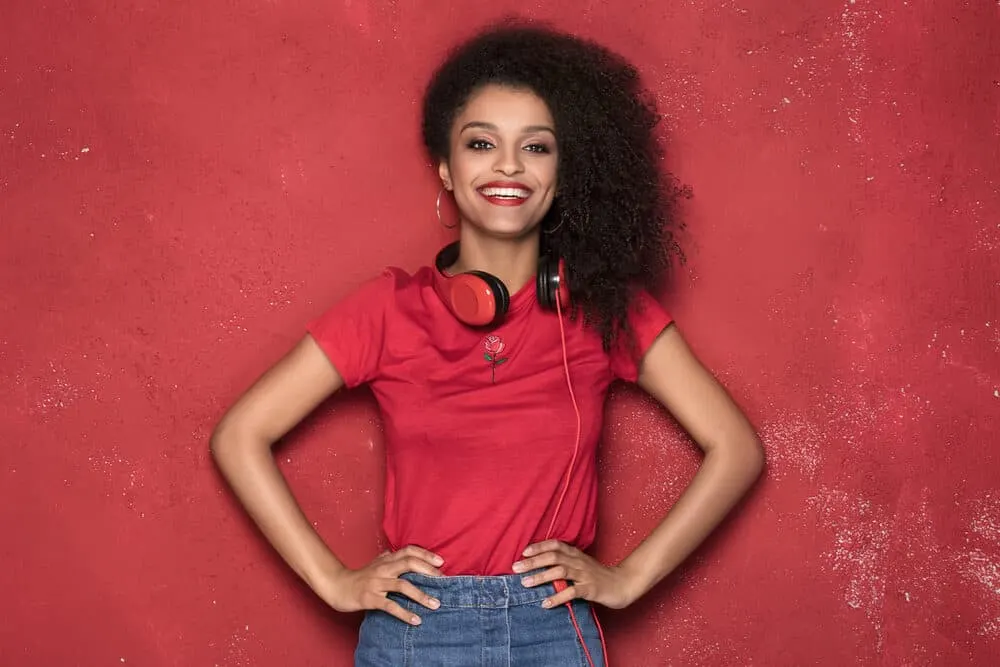 Should You Brush Curly Hair? Wet or Dry? Everyday? Before Bed? 2 Cute black girl with a 3C curl pattern wearing a wash and go style created with natural oils and a wide-tooth comb.