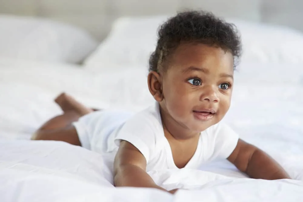 Baby Hair on Ultrasound vs When Born: When Can You Tell? 4 A cute baby girl that grew a lot of hair during fetal development getting to ready celebrate her first birthday.