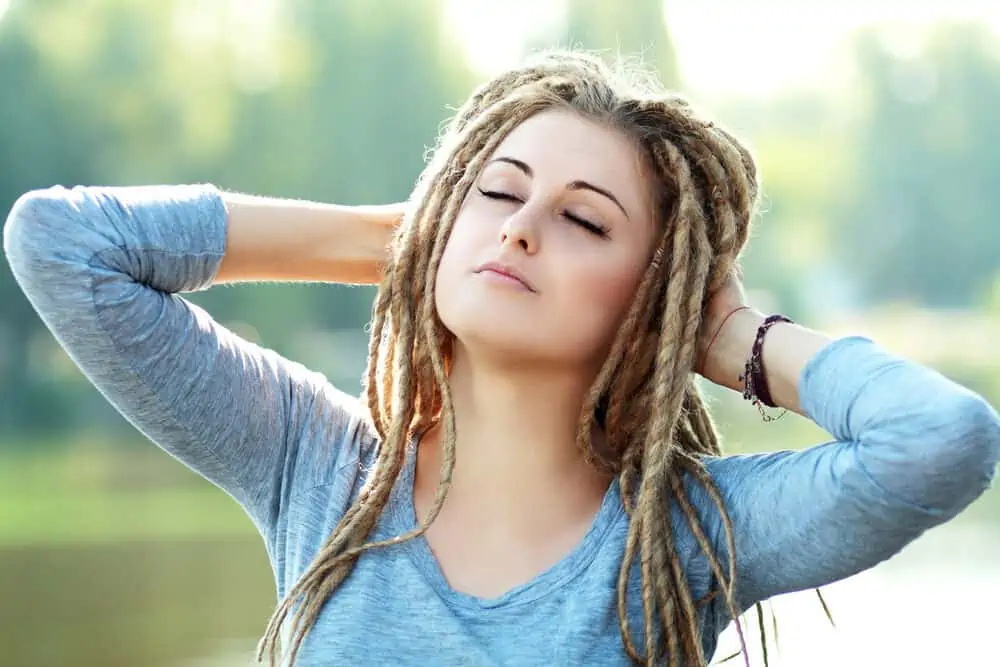 Beautiful Caucasian woman with twisted locks which would normally only be possible on afro hair from a black person.