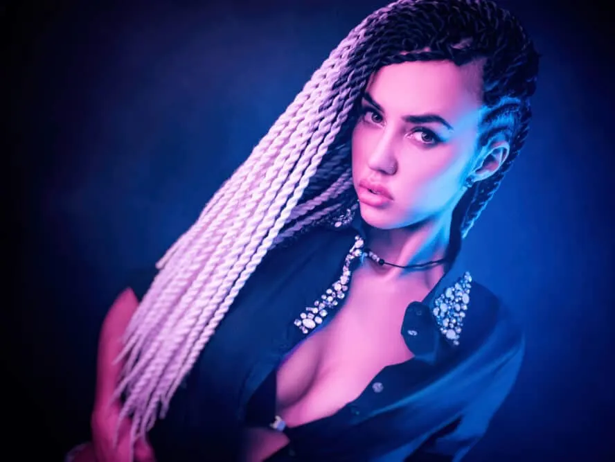 A Thai female wearing cornrows that are normally common in hip hop and black culture.