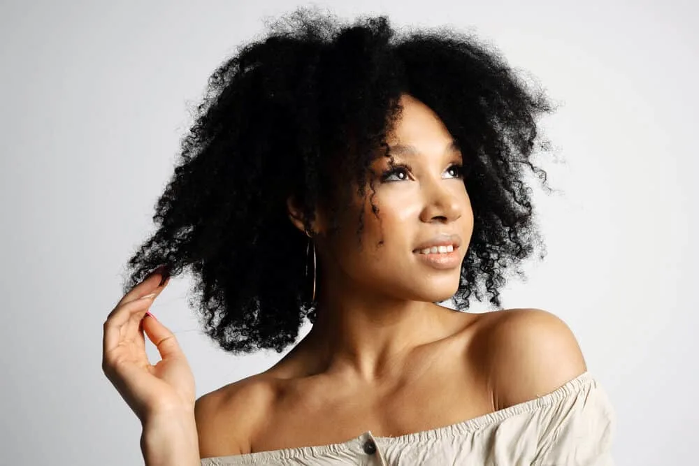 Does Vegamour Work for Hair Loss? Thinning Hair? Alopecia? 1 African American female with noticeably denser hair strands is concerned about hormone-related hair loss.