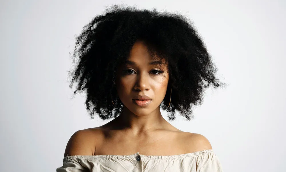 Does Vegamour Work for Hair Loss? Thinning Hair? Alopecia? 7 Young African American female that uses Vegamour hair serum to combat female hair loss and stimulate hair regrowth.