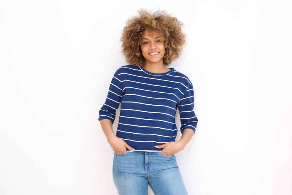 African American female with subtle highlights after washing her curls with a DIY baking soda rinse.