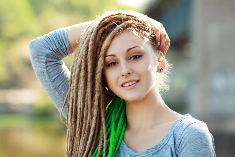 A white person with a dreadlock style on matted hair (which is sometimes considered cultural appropriation).