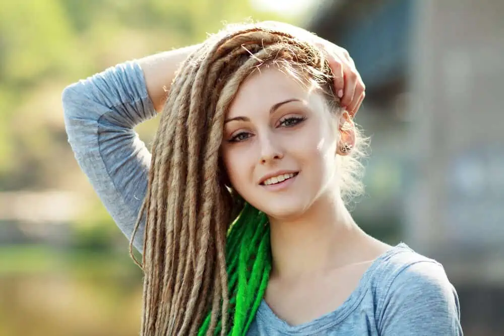 A white person with a dreadlock style on matted hair (which is sometimes considered cultural appropriation).