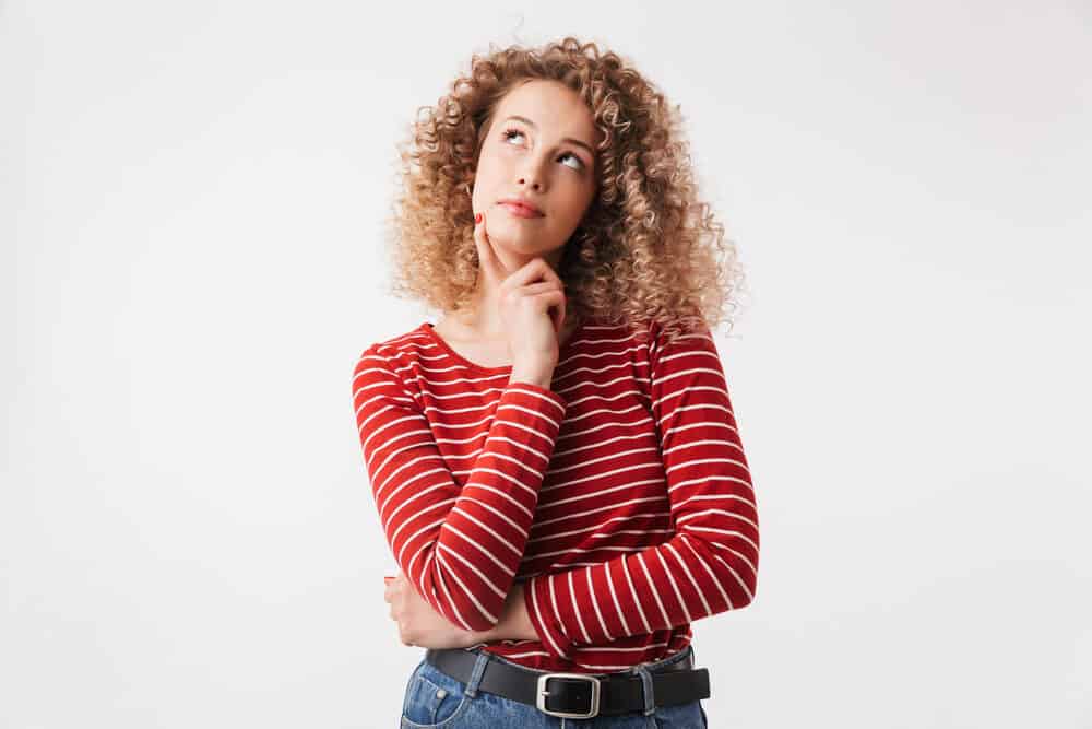 Young white female with medium length hair and blonde hair color wearing her hair loose.