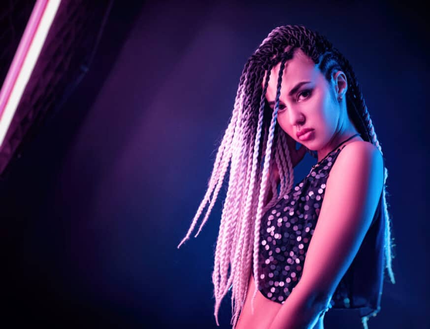 Cute Thai girl wearing a Thai traditional hairstyle with braided hair that's uncommon among non-black people.