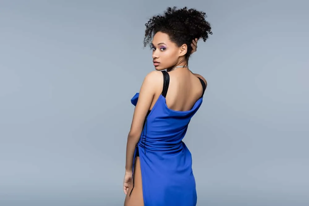 Should You Do Hair or Makeup First When Getting Ready? 4 Black girl wearing a cute dress at the wedding party's walkthrough, consultation, and trial session before the event.