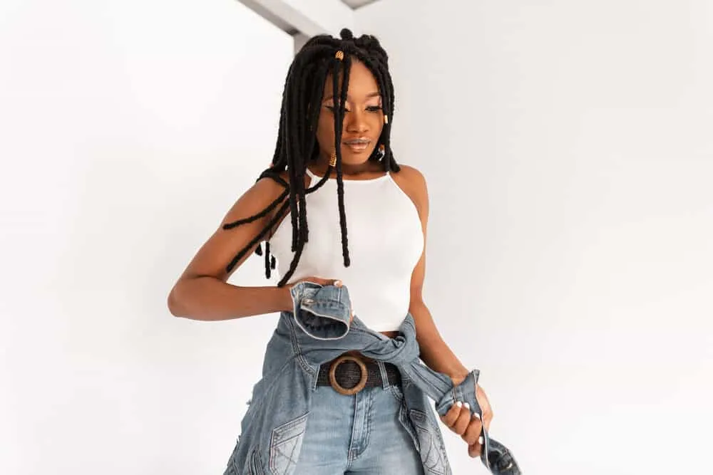 Where Did Dreadlocks Originate? The True History of Dreadlocks 8 A fashionable African American female with long dreadlocks that choose to wear locks to due to their cultural history.