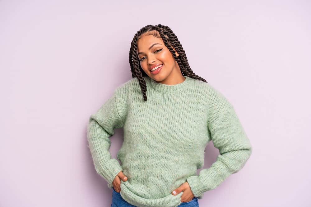 A Mexican female with thin hair wearing box braids which is one of the most common Latina braid hairstyles.