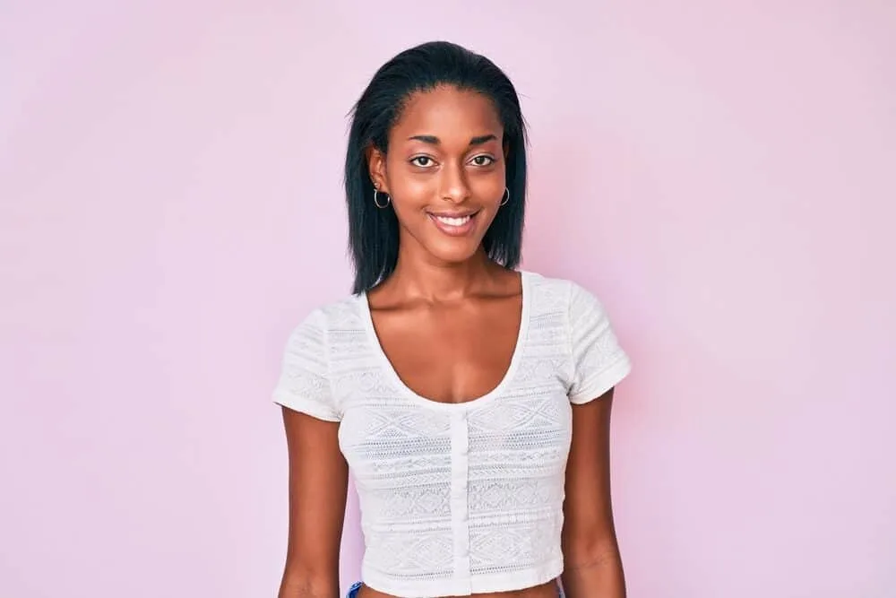Best Steam Straighteners for Black, Curly, and Natural Hair 1 Young African American female with fine hair strands after using the MKBOO hair straightener on her dry hair.