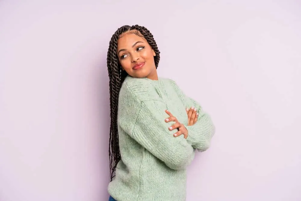 Mexican Braids: Are Braids Part of Mexican Culture? 7 Cute Mexican female with long hair wearing a braided hairstyle that conforms to her oval face shape.