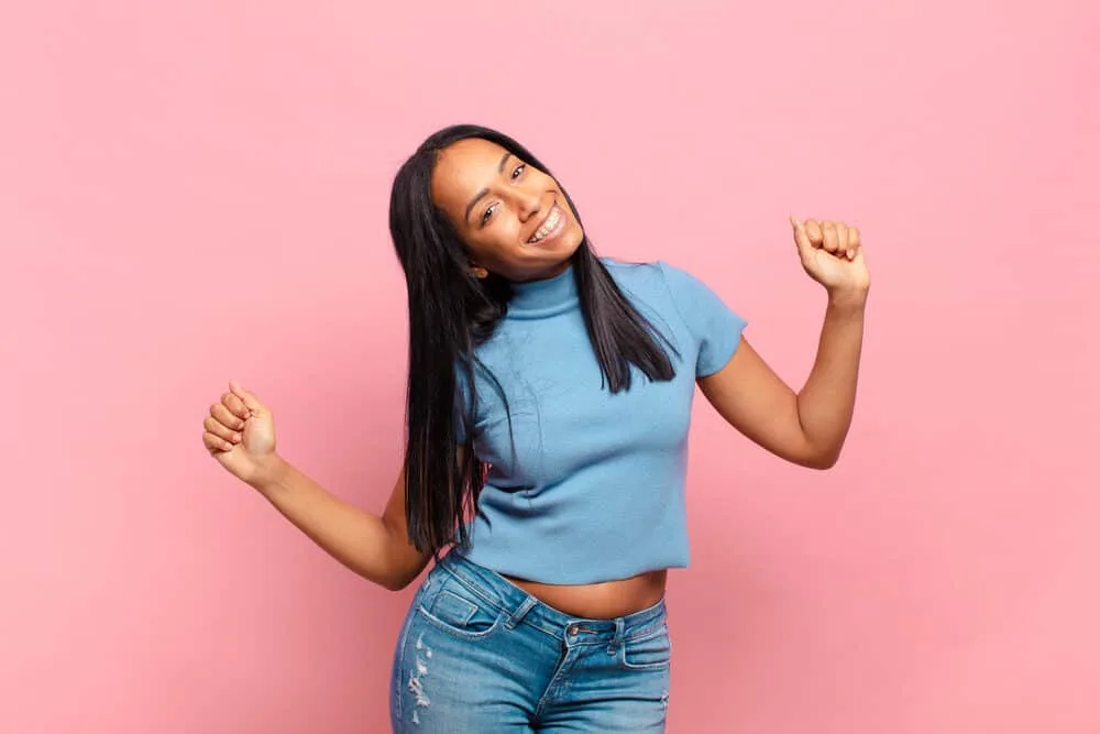 Do Flat Irons Damage Hair? Are Flat Irons Bad for Your Hair? 5 A cute young African American female with a 4A hair type just finished her hair styling routine.