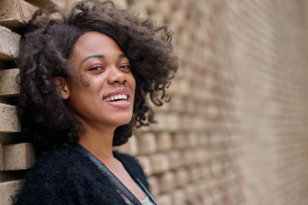 Young African American female wearing a quality lace front wig made from Remy human hair.