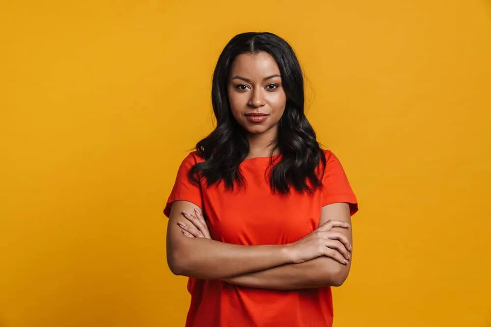 Can You Flat Iron Your Hair After Dyeing It? Should You Wait? 6 A black girl dyed her own hair darker at a hair salon by a licensed cosmetologist.