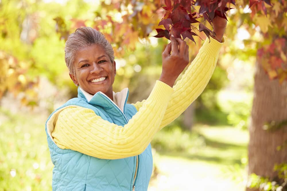 An older black lady with salt and pepper hair has dark hair streaks instead of just the gray hair you'd expect.