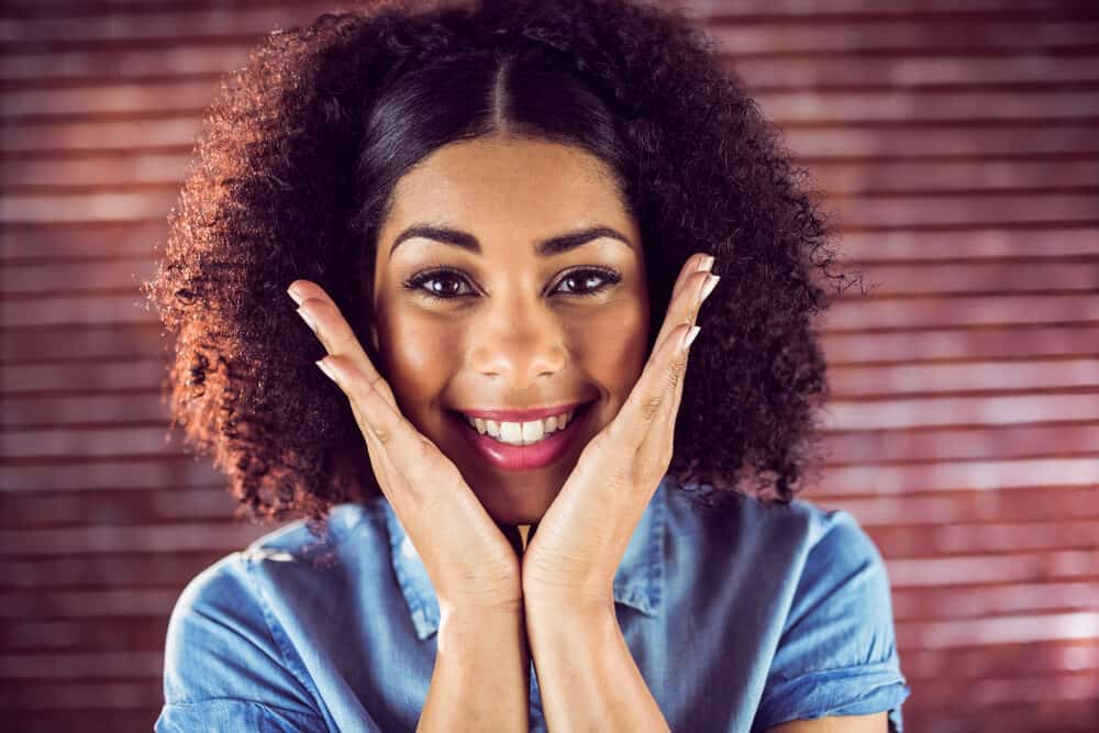 Pretty African American female wearing a lace front wig covering her individual hairs.