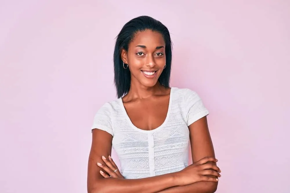Best Steam Straighteners for Black, Curly, and Natural Hair 4 African American female with natural black hair wearing a bone-straight hairstyle created with a straightening iron.