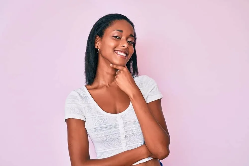 Best Steam Straighteners for Black, Curly, and Natural Hair 6 Black woman with a 4A hair type after styling her hair with a metal-ceramic heater with vapor infusion technology.