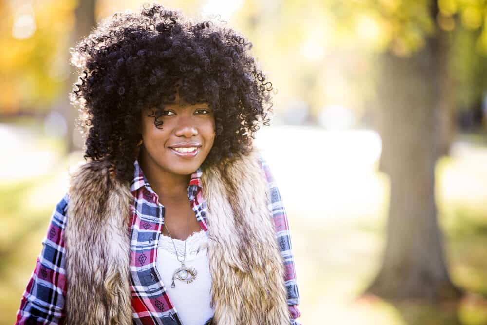 African American lady suffering from hair loss wearing a natural hair wig.