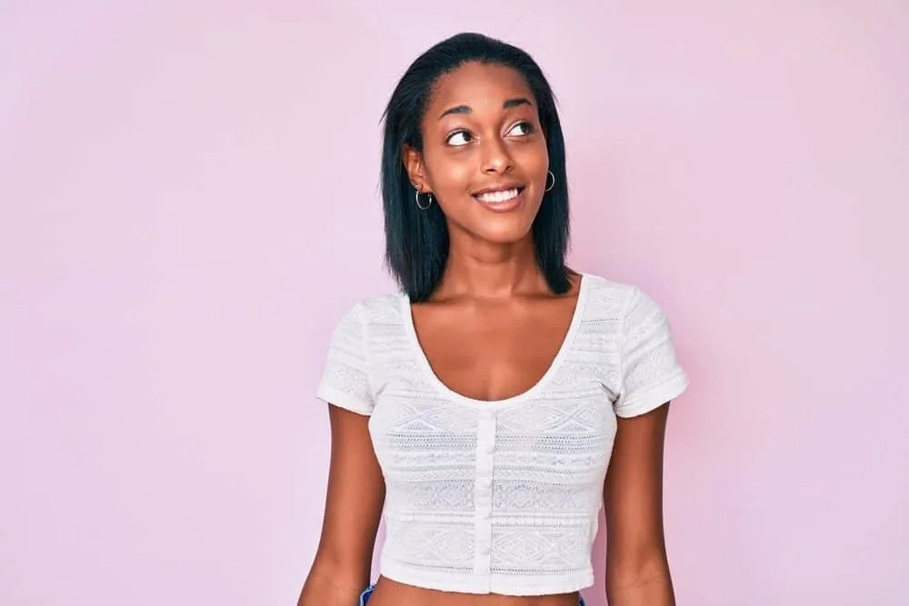 Best Steam Straighteners for Black, Curly, and Natural Hair 2 Young African American female with damaged hair cuticles after using a professional hair straightener with heat plates.