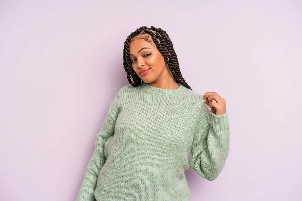 Mexican Braids: Are Braids Part of Mexican Culture? 8 Latina female wearing an edgy-side braid look that can be converted into a cute updo or adorned with colorful beads.