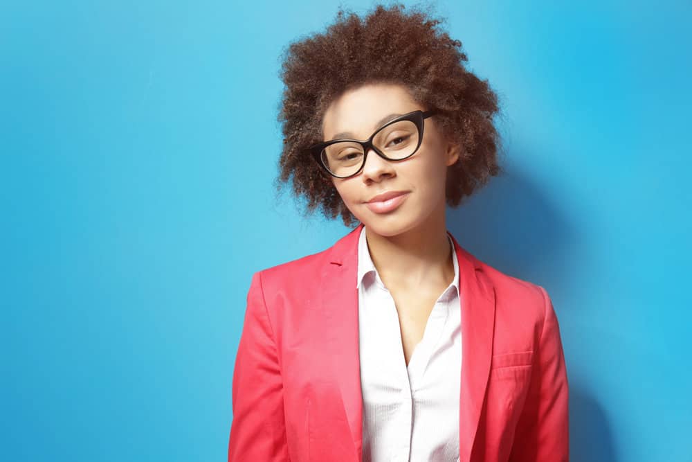 African American female with a lighter shade of brown hair dye turned her healthy hair dry due to harsh chemicals.