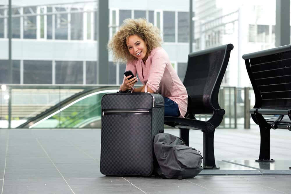 A female traveler preparing for air travel at the local Birmingham Internal Airport as she travels to Houston.