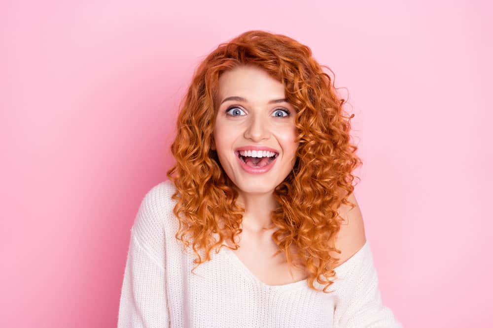 Cute white lady with thick hair after using African American hair dye and Care-free Curl Gold coconut oil.