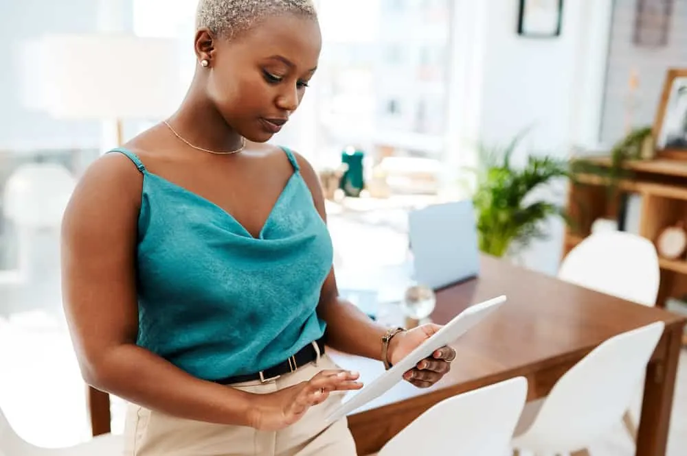 TWA Hairstyles: Short and Medium TWA Styles and Haircuts 8 Black woman wearing a short hairstyle with an interesting shaved design that's all the rage.