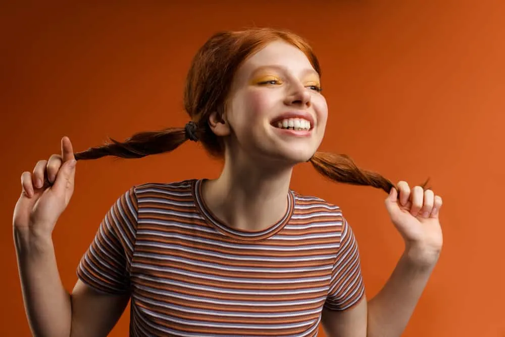 How to Fix Orange Hair With Box Dye: DIY Step-By-Step Guide 7 White female with orange hair after bleaching her natural dark ash blonde 1C hair strands.