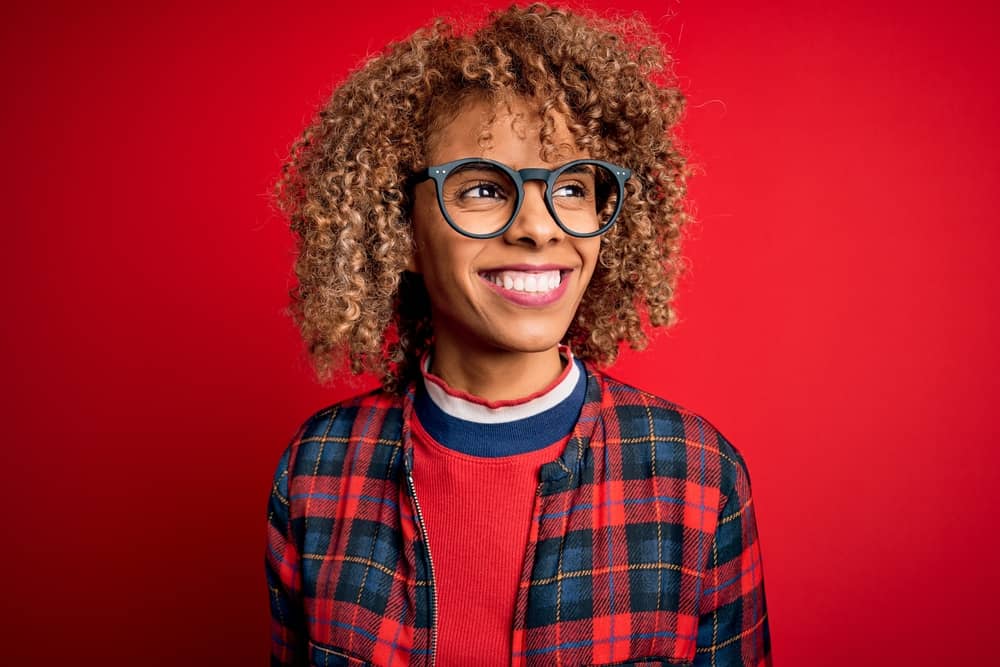 A female with previously bleached hair is concerned due to having split ends and her thick hair falling out.