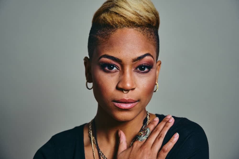 How to Dilute 40-Volume Developer to 20: DIY Diluting 1 African American female with a naturally dark hair tone styled with box dye and hair developer to create blonde hair.