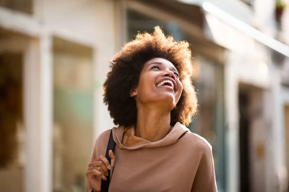 Why Is My Hair Matting Underneath? Prevent Hair From Matting 9 African American female with tangle-free hair after using a deep conditioning treatment on her 4C curls.